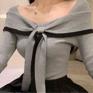 Elegant Gray Off-Shoulder Sweater with Black Bow